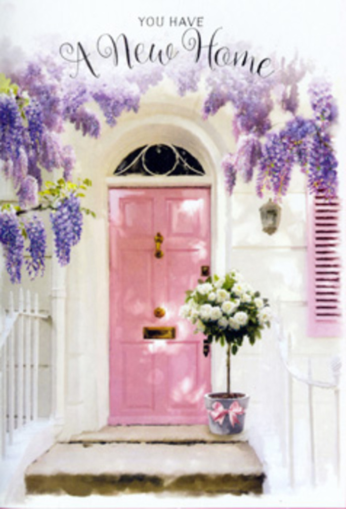 In this scene, a Chigwell doorway is transformed into a tender welcome, the sort of entrance a local florist might lovingly prepare for a couple receiving their keys for the first time. The wooden front door is painted a soft, rosy pink, the kind of hue that looks especially charming in the late afternoon light drifting across quiet streets near Hainault Road. Surrounding it, the wall is washed in a gentle white, its lightly textured surface reflecting light and adding calm, while a single shutter, brushed with the same blush tone as the door, ties the whole composition together with subtle balance. Above, lush wisteria falls in lavender streams, the clusters of small blossoms hanging gracefully like draped velvet, suggesting a heady, springtime perfume. At the base of this floral frame, a simple tin bucket, weathered in a fashionable, vintage style, holds a generous gathering of white and cream roses. Their blooms are full and cushiony, some unfurling, others still cupped, each one surrounded by soft, green foliage that adds airiness and freshness. A satin ribbon in a delicate pink is tied securely around the bucket, its bow slightly off-centre in that effortless way that shows a human hand has just finished adjusting it. The light catches both the ribbon and the rose petals, creating a soft sheen that enhances their pastel tones. Everything feels poised yet relaxed, like the moment just before guests arrive to toast a new Chigwell home. The image carries a sense of optimism, gentle nerves, and quiet joy, as if the flowers themselves are offering congratulations and promising comfort in the days ahead.